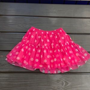 This Pink polka dot skirt is a size 5 (youth)